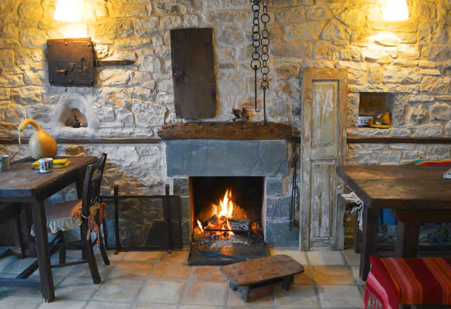 The fireplace in the main sitting area of the Jazz bar-restaurant Anemi in Pindus, Epirus, Greece