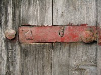 Iron strap door hinge on an old wooden door in the traditional village of Dilopho n Epirus, Greece