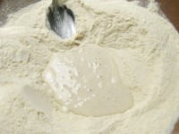 Mixing the sourdough carefully with the flour