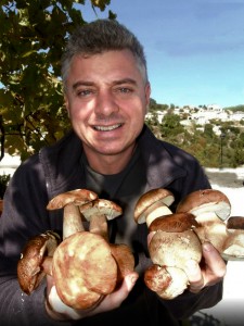 The chef of Kanela and Garyfallo holding boleti mushrooms from the region of Zagori