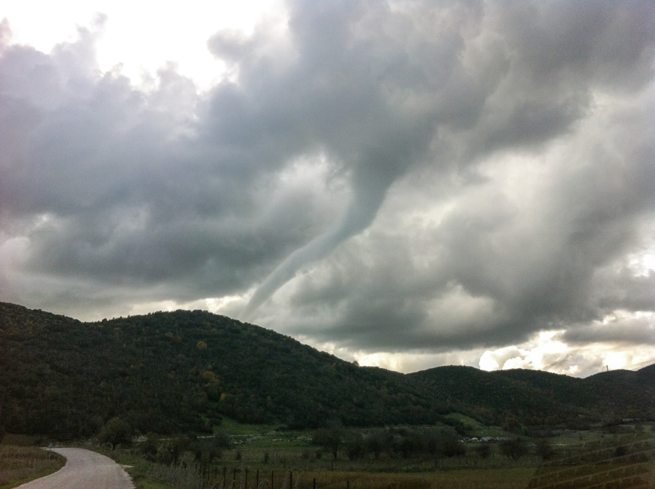 A tornado vortex heading towards Kato Pedina village in the Zagorochoria region in Epirus, Greece  during fall 2014