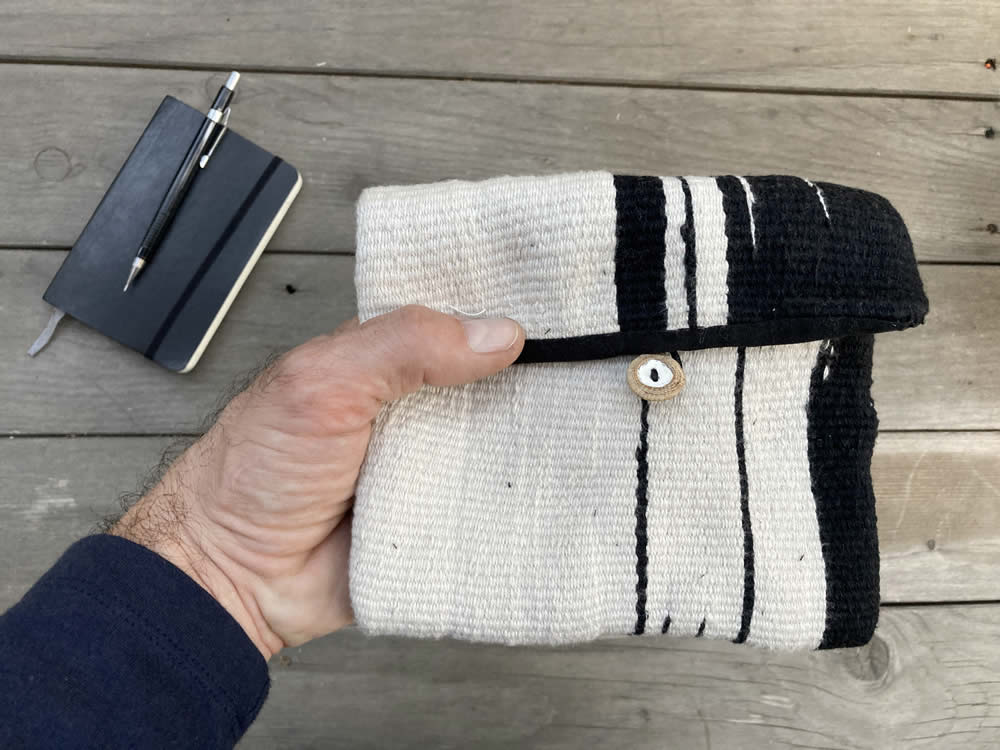 Handmade black and white loom pouch. A one-off handmade woven small pouch. Ideal for carrying around all those small daily essentials on the go by Marinaporcini