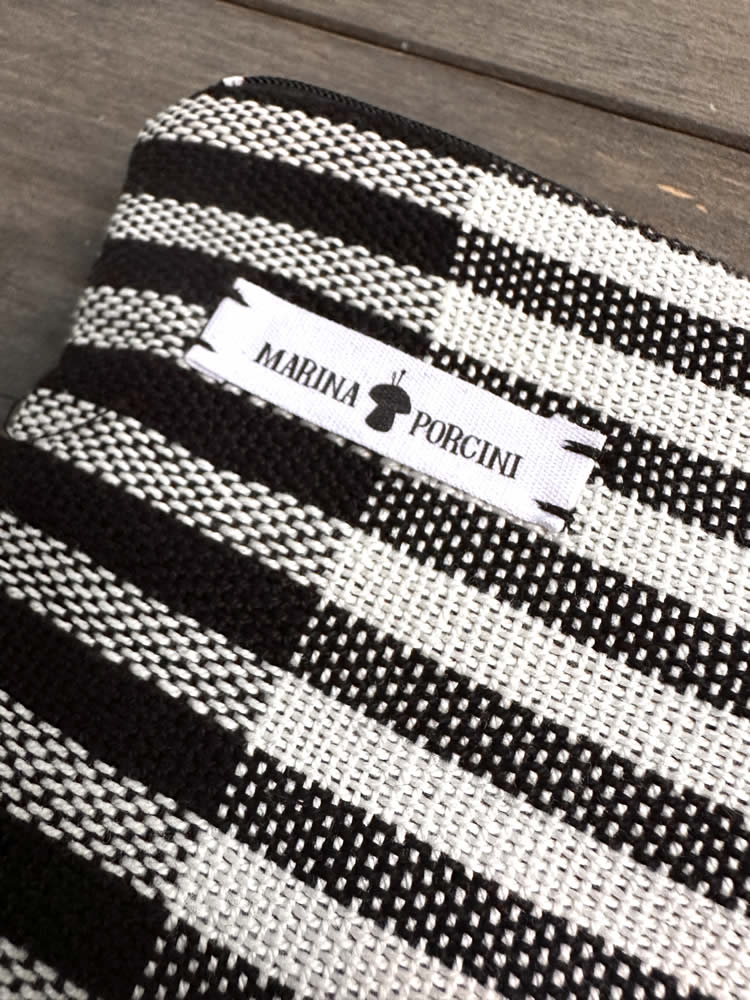 Black & white zipper clutch bag with horizontal stripes. Handmade woven medium sized clutch bag (purses) in alternating black and white stripes by Marinaporcini